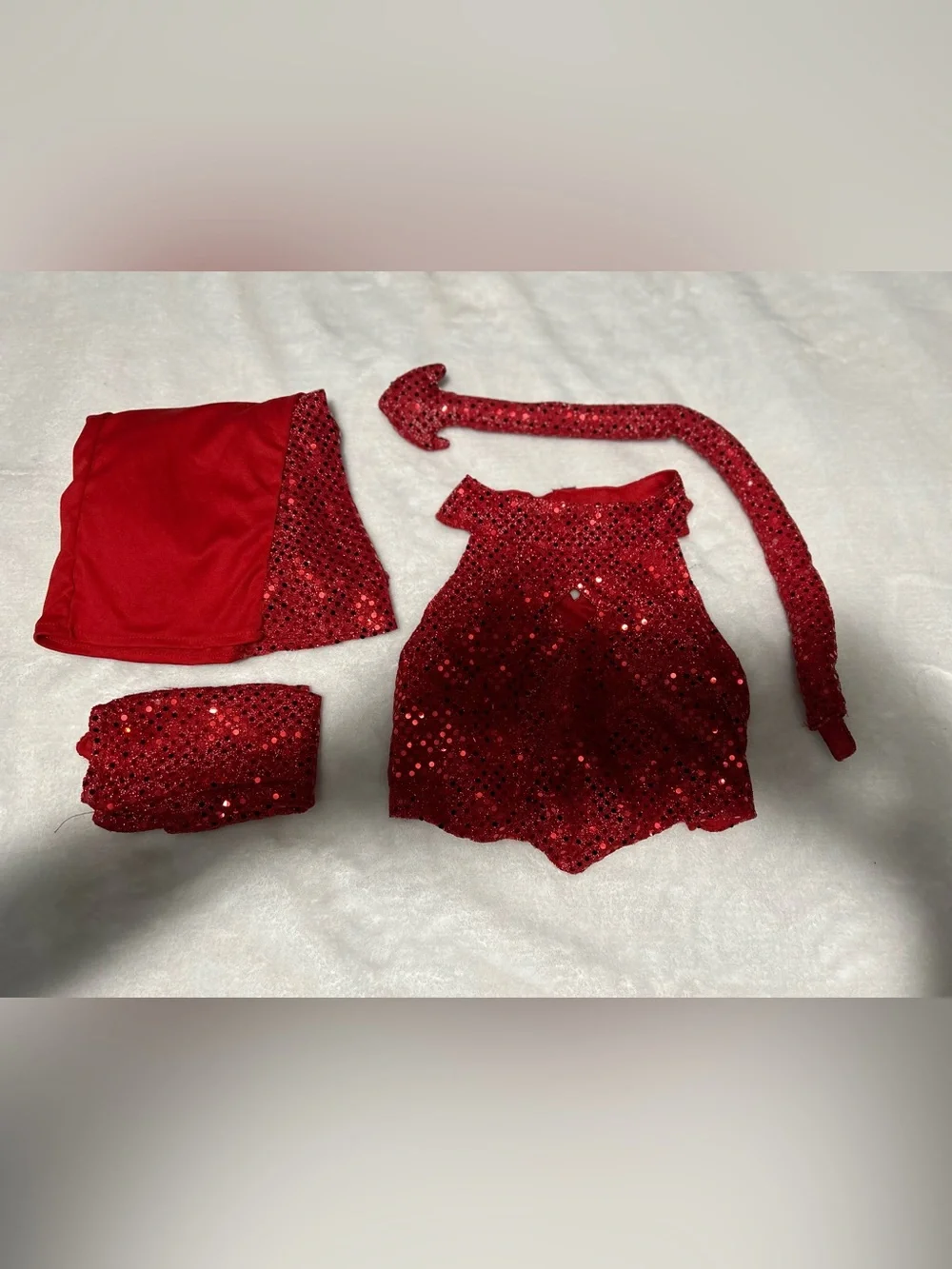 Kids Red Sequin Devil Costume Set comes with pants, top, gloves and pitchfork.